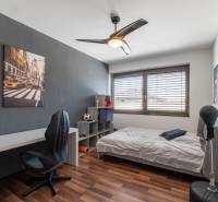 Children's room with a desk and a bed in a family house.