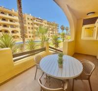 Recreational apartment in Los Alcázares with garden furniture and pool view.