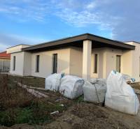 Construction of houses in Western Slovakia: new building with a flat roof and building material.