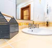 Bathroom with a sink and decoration in a 3-room apartment.