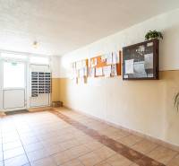 Entrance hallway with mailboxes and an information board in a 3-room apartment.