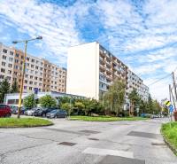 A view of apartment buildings in Košice on Žižkova Street, Juh district, with parking.