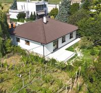 A family house on Roľnícka Street in Bratislava - Vajnory, surrounded by a garden and a vineyard.