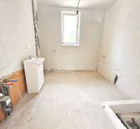 Bathroom renovation in a family house with a sink and installation connections.