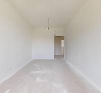 Empty room in a family house with white walls and hanging electrical installation.