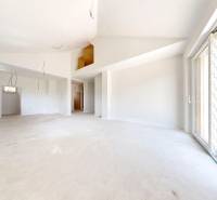 Bright room with large windows and an empty floor in a Family house.