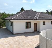 A family house on Roľnícka Street in Bratislava - Vajnory with a garden and a paved courtyard.