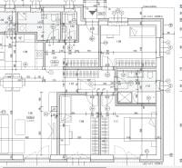 Floor plan of a family house with rooms: kitchen, living room, bedrooms, and bathrooms.