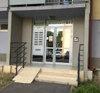 Entrance portal of an apartment building on Bratislavská Street in Senec with a modern glass entrance.