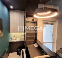 Office space with reception, shelves, and lighting.