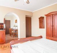 Interior of a room with wooden furniture and a television in hotels and guesthouses.
