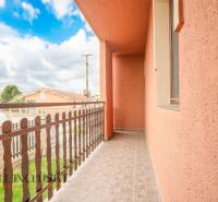 Balcony in hotels and guesthouses in Veľký Meder with a view of the surrounding architecture.