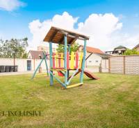 Children's playground with a wooden structure in the area of hotels and guesthouses in Veľký Meder.