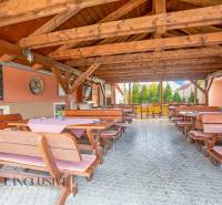 Wooden gazebo with benches and tables in hotels and guesthouses in Veľký Meder.