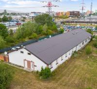A building with a metal roof and greenery on Vajnorská Street, Bratislava - Nové Mesto, offices.