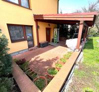 A family house in Vyšná Myšľa with a terrace, garden, and brick walkway.