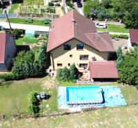 A family house in Vyšná Myšľa with a swimming pool and garden in a peaceful environment.