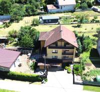 A family house in Vyšná Myšľa with a large garden and neighboring development.