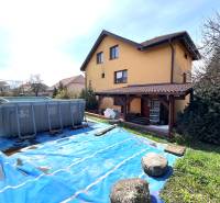A family house in Vyšná Myšľa with an above-ground pool in the garden and a terrace.