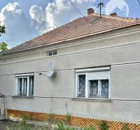 A family house in Bátorove Kosihy with a classic roof covering and a satellite dish.