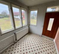 Interior with vintage tiles and large windows, view of the garden in Lietavská Lúčka.