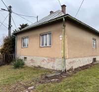 A house on Lietavská Lúčka street with a large yard and a gray roof.