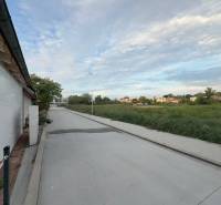 Residential plots in Malinovo on Cintorínska Street with a view of nature and the road.