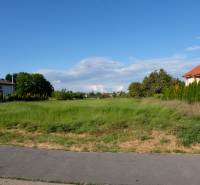 A plot designated for residential use on Cintorínska Street in Malinovo, surrounded by development.