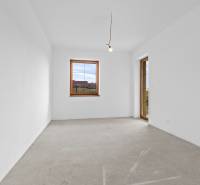 Empty room with a window and balcony door in a family house.