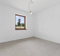 Empty room in a family house with a window and a light bulb on the ceiling.