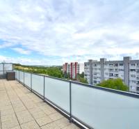 A spacious terrace at the 4-room apartment offers a view of Bratislava - Rača, Pri vinohradoch.