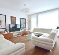 Bright living room with a sofa and decorations in a 4-room apartment.