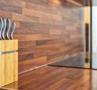 A wooden kitchen counter with knives in a 3-room apartment.