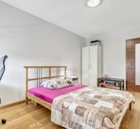 Bedroom in a 3-room apartment with a bed, desk, and wardrobe.