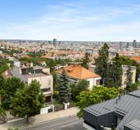 View of Bratislava - Old Town from Mudroňova Street, surrounded by family houses and greenery.