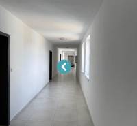 A long corridor in Poprad on Hurbanova Street, leading to 2-room apartments.