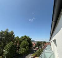 A view of Hurbanova Street in Poprad from the window of a 2-room apartment with a balcony.