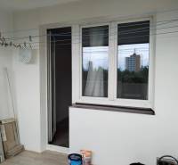 A balcony of a 2-room apartment with a view of the city.