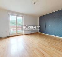 A spacious room with laminate flooring and a large window, part of a 3-room apartment.