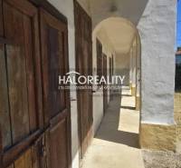 The hallway of a family house in Váhovce with older wooden doors and arches.