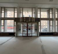 Spacious commercial spaces with large windows and glass doors.