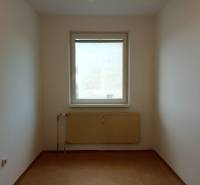 A small room with a radiator and a window in a 3-room apartment.