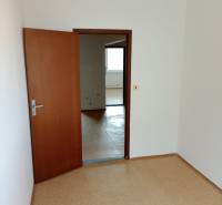 A room in a 3-room apartment with open doors, the floor covered with light linoleum.