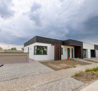 A family house in Vrakúň, Dunajská Streda, with interlocking paving and minimalist architecture.