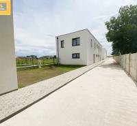 Modern buildings on Untere Hauptstraße in Potzneusiedl, the photograph captures the exterior with a driveway.
