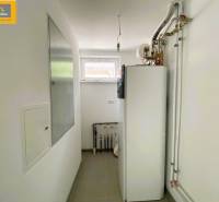 Utility room in a 5 or more bedroom apartment with a boiler and piping.
