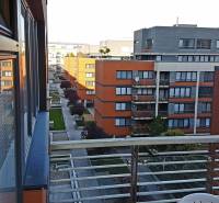 A view from the window of a courtyard with greenery and buildings in Bratislava - Ružinov.