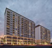 Construction of apartments on Panónska Road in Bratislava - Petržalka. Two illuminated apartment buildings.