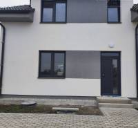 A family house in Zemianska Olča with two floors and a paved area on Zemianska Olča street.