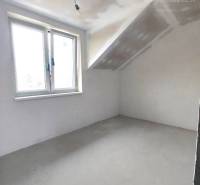 Unfurnished room with a window and a light bulb in a family house.